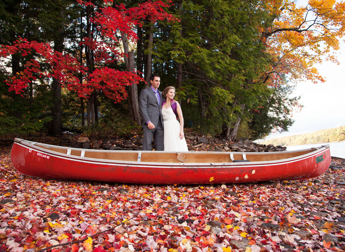 bride and groom portrait with canoe in Muskoka