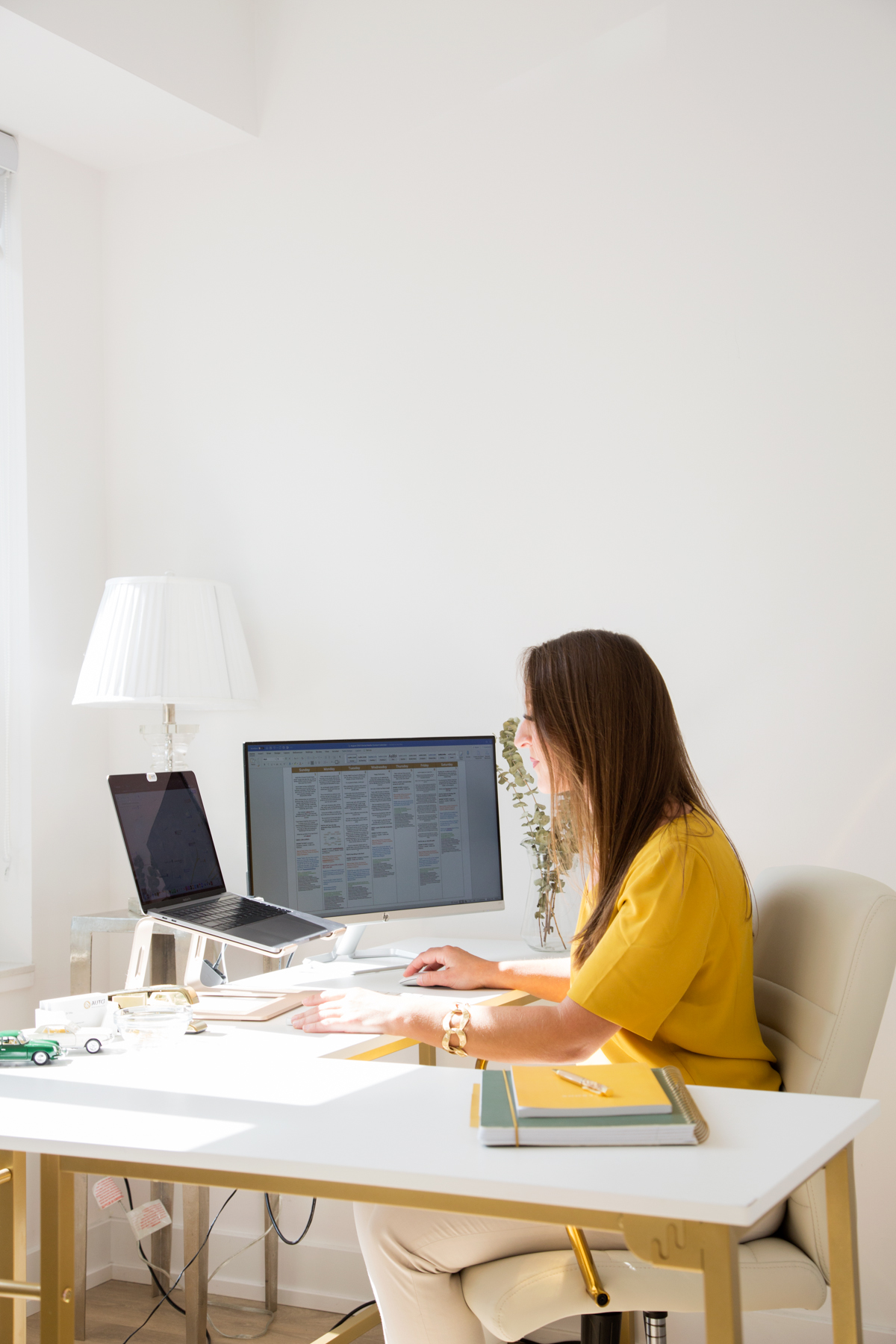 personal branding photo of woman working at desk 