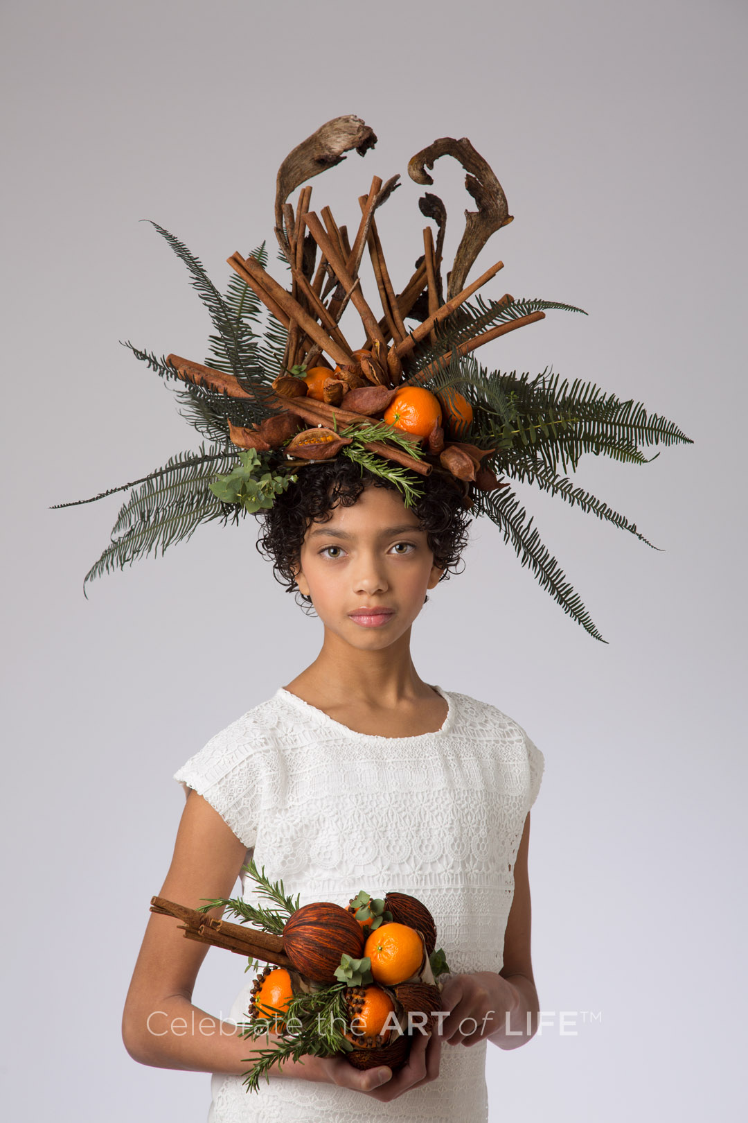 editorial portrait child with unique floral head dress