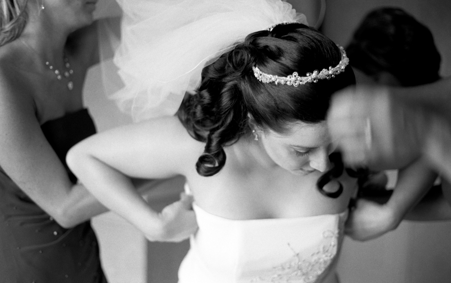 fine art black and white portrait of bride getting ready